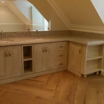 A custom bathroom cabinet installation using techniqued supawood
