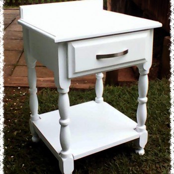 Bedside table in solid wood painted white with ornate turned legs
