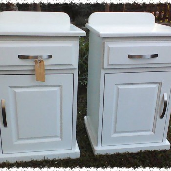 Set of solid timber painted white bedside tables with drawers and cupboard door. Simple yet elegant