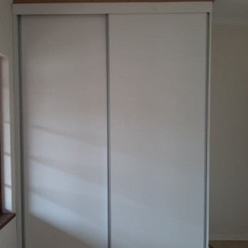 built in cupboard with sliding door