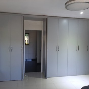 built-in cupboards with hidden door