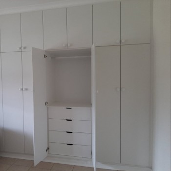 built-in cupboards showing inner storage pullout shelves