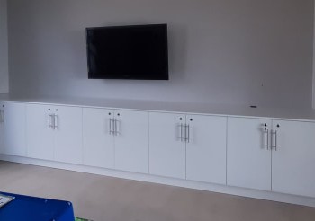 built-in tv room cupboards in white