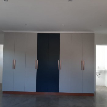 custom office cupboards built-in blue white and with rose copper handles