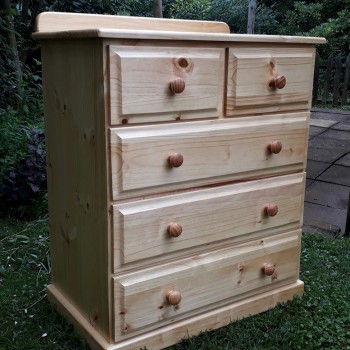 Simple pine chest of drawers with round handles