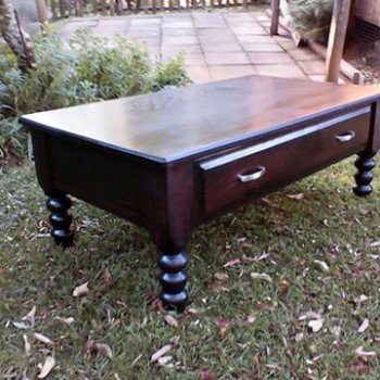 Coffee table with a dark stain in solid wood