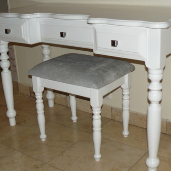 Curved and detailed white dressing table with matching upholstered stool