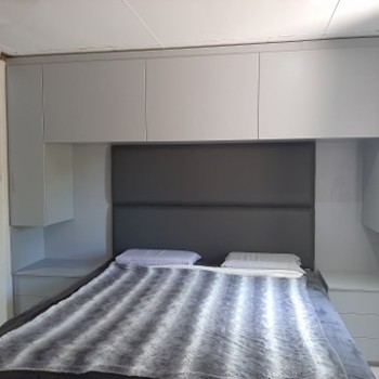 Custom built in headboard and bedroom cupboard storage