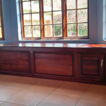 custom designed window seat storage in solid timber