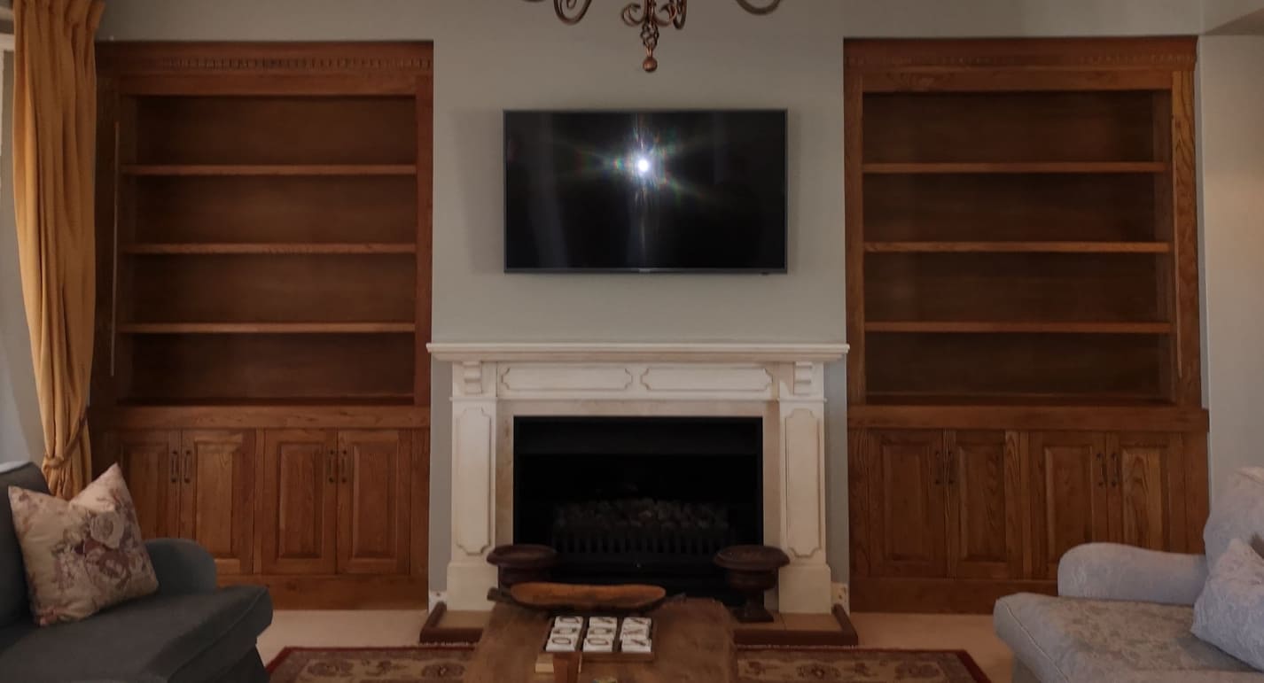 Full built-in custom bookcase and storage in solid oak