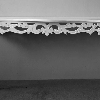 curved leg side table with ornate carving detail in white