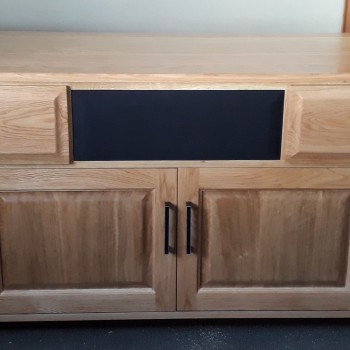 Oak TV unit with built-in speaker covers and pocket doors